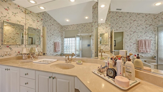 bathroom featuring vanity and plus walk in shower