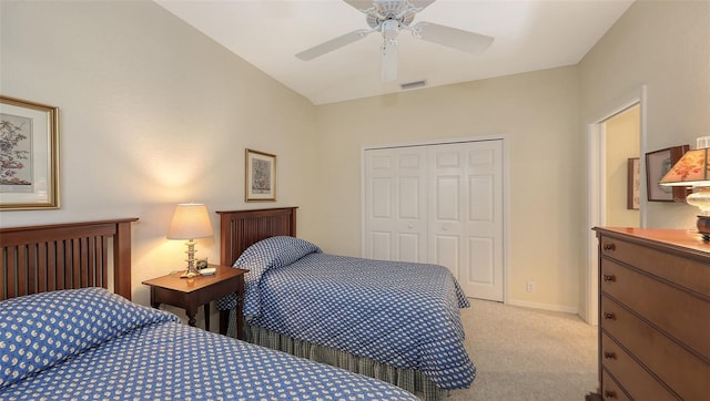 bedroom with ceiling fan, a closet, and light carpet