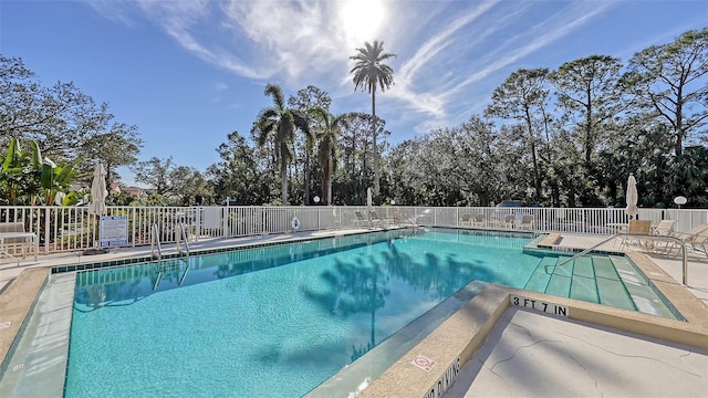 view of swimming pool featuring a patio area