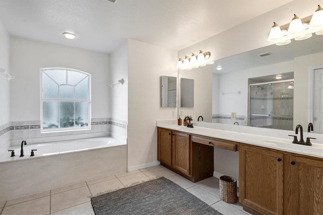 bathroom with tile patterned flooring, vanity, and separate shower and tub