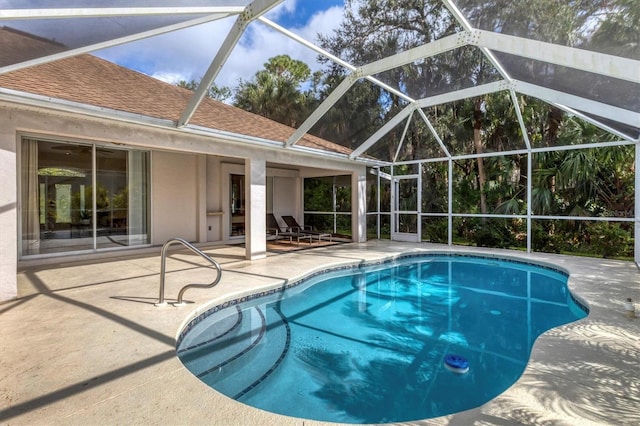 view of pool with a lanai and a patio area