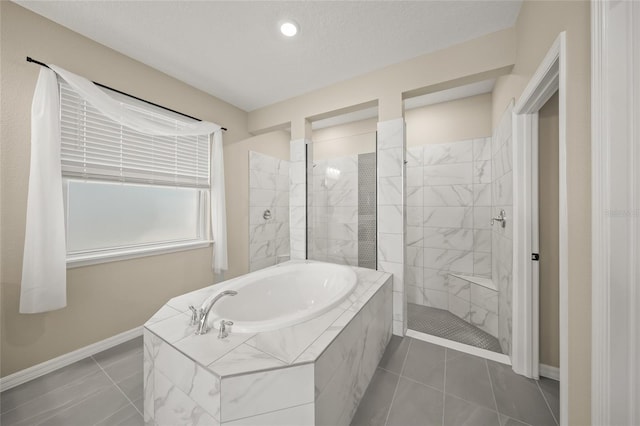 bathroom with shower with separate bathtub, tile patterned floors, and a textured ceiling