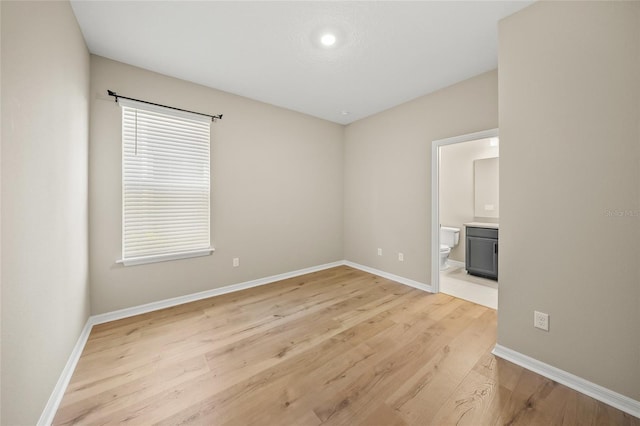 spare room with light wood-type flooring