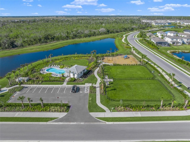 birds eye view of property with a water view