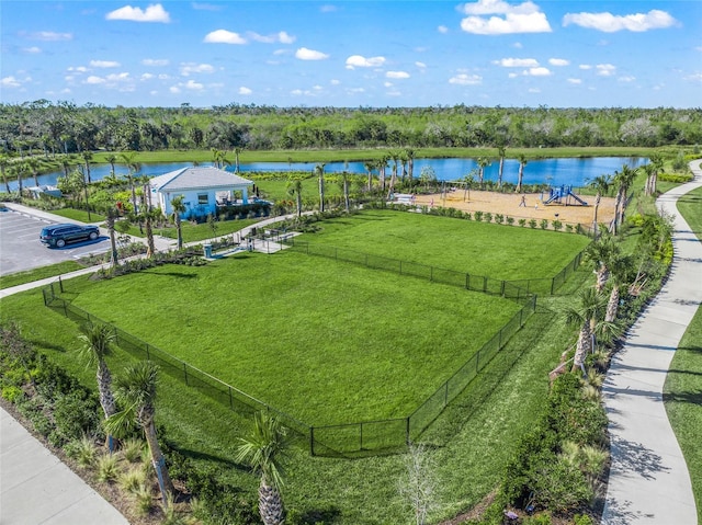 birds eye view of property with a water view