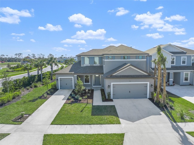 view of front of property featuring a front yard and a garage