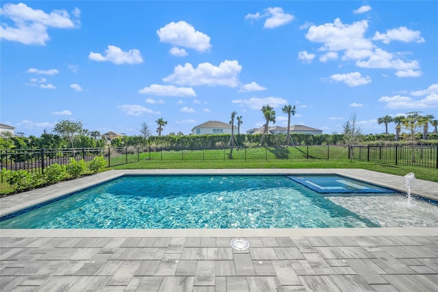 view of swimming pool featuring an in ground hot tub and a lawn