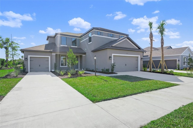 front facade with a front yard and a garage