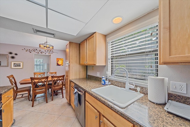 kitchen with sink, light tile patterned flooring, pendant lighting, dishwasher, and light brown cabinets