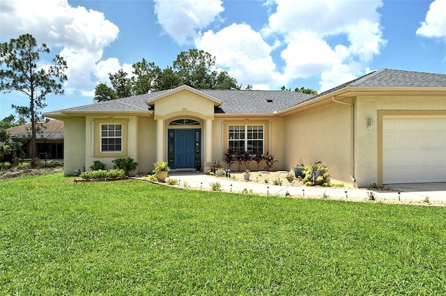 single story home with a front lawn and a garage