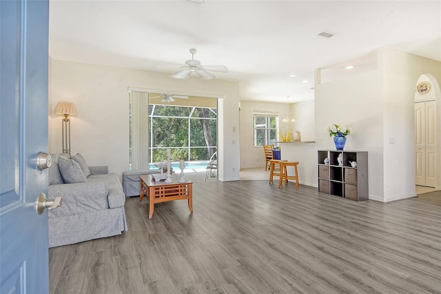 living room with hardwood / wood-style floors and ceiling fan