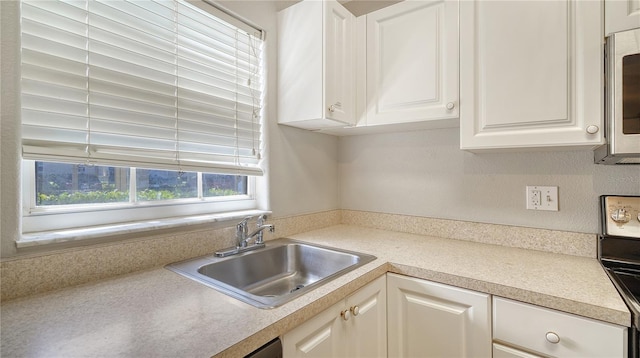 kitchen with white cabinets and sink