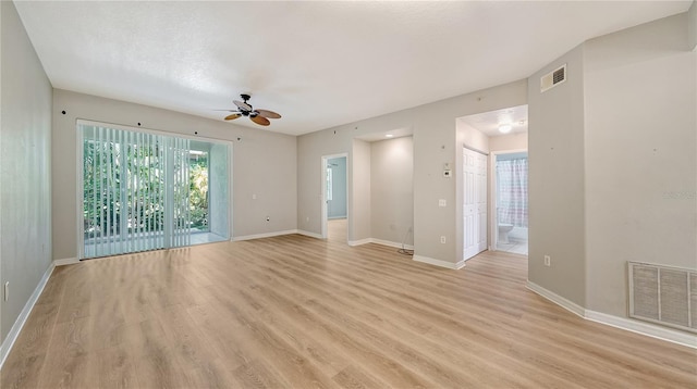 spare room featuring ceiling fan and light hardwood / wood-style flooring