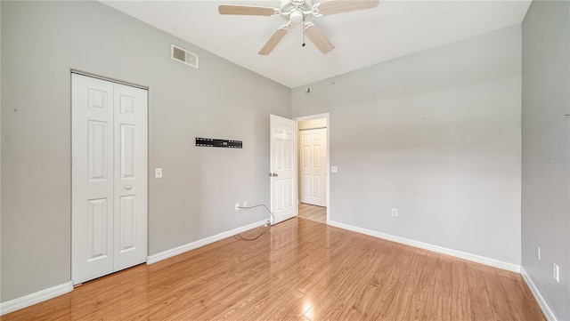 spare room with light hardwood / wood-style flooring and ceiling fan