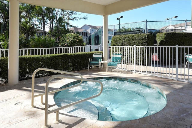 view of pool featuring a hot tub