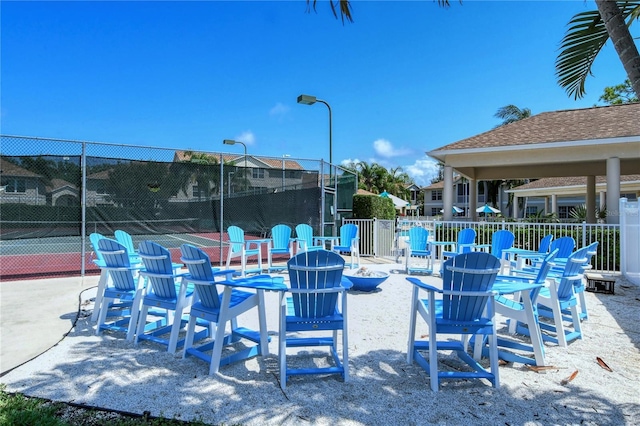 view of patio with tennis court