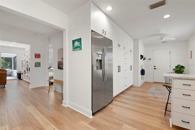 interior space with hardwood / wood-style flooring and ceiling fan