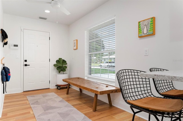 sitting room with light wood-type flooring and ceiling fan