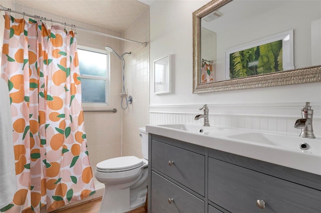 bathroom with curtained shower, vanity, wood-type flooring, and toilet