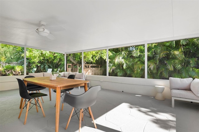 sunroom / solarium featuring ceiling fan