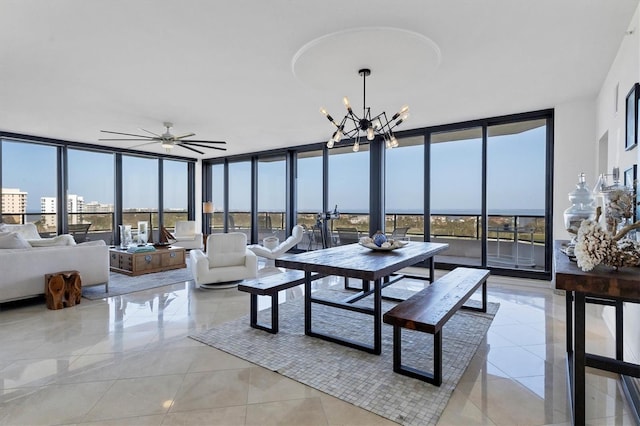 sunroom / solarium featuring ceiling fan with notable chandelier