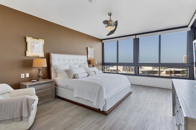 bedroom featuring ceiling fan and light wood-type flooring