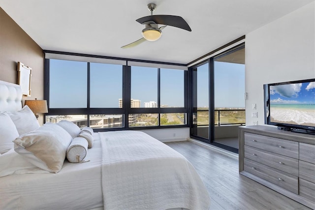 bedroom with hardwood / wood-style flooring and ceiling fan