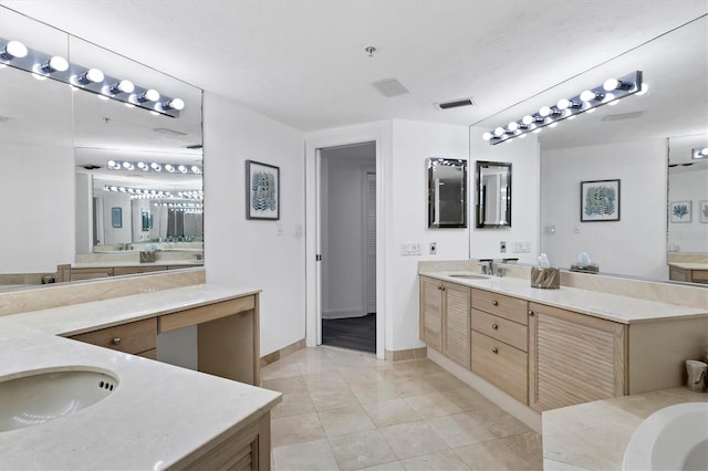 bathroom featuring tile patterned floors and vanity