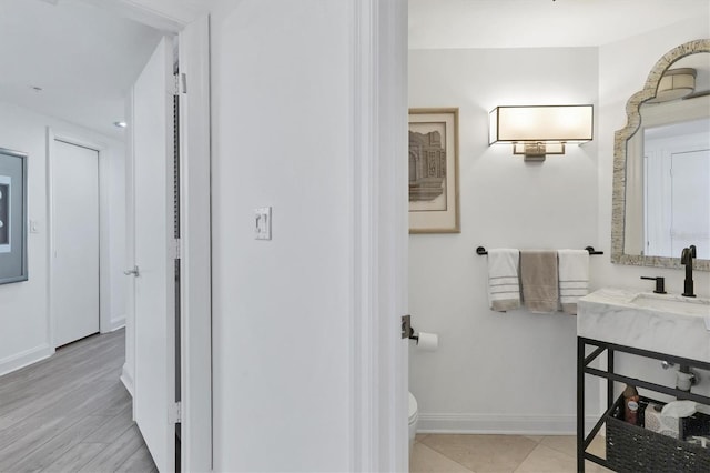 bathroom featuring toilet and sink