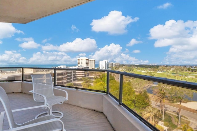 balcony featuring a water view