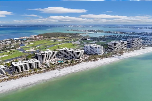 bird's eye view with a water view and a view of the beach