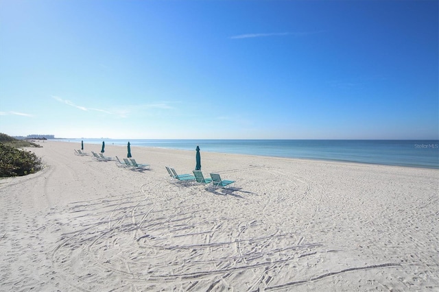 property view of water featuring a beach view