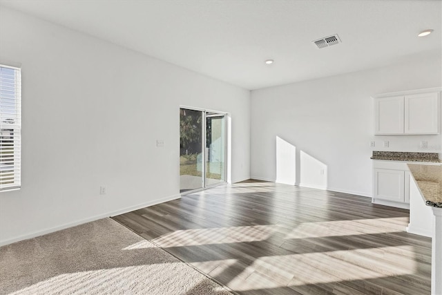 unfurnished living room with hardwood / wood-style floors