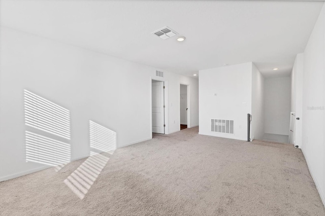 spare room with light colored carpet