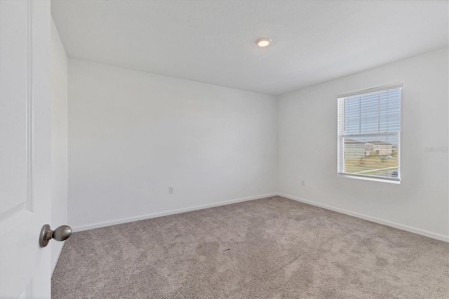 empty room with light colored carpet