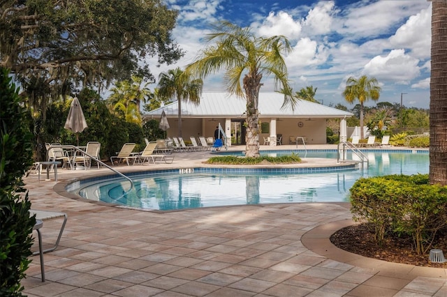 view of swimming pool with a patio area