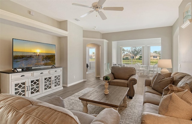 living room featuring hardwood / wood-style flooring and ceiling fan