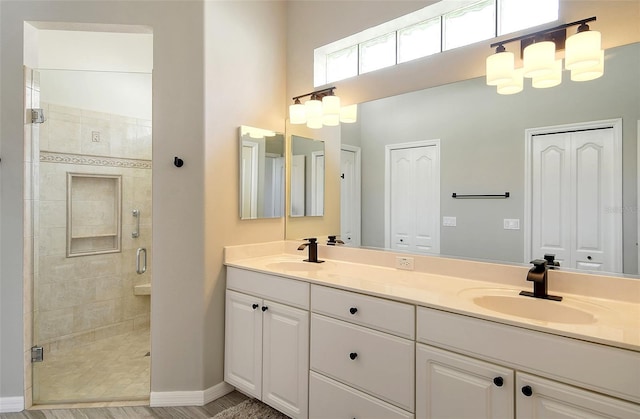 bathroom featuring vanity and an enclosed shower