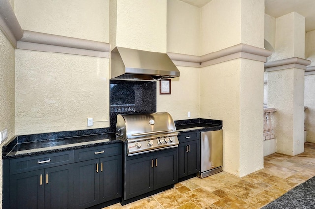 view of patio / terrace with an outdoor kitchen and a grill