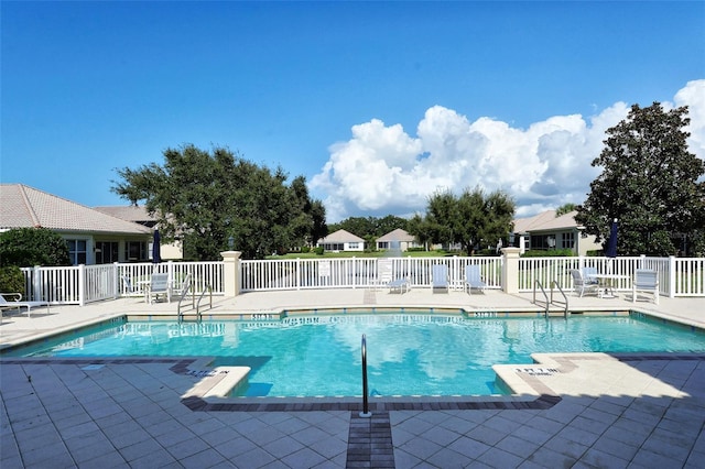 view of swimming pool featuring a patio area