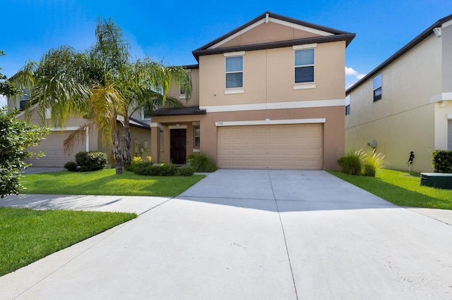 view of front property featuring central air condition unit, a front yard, and a garage