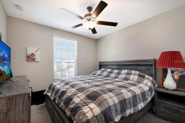 bedroom featuring ceiling fan and light colored carpet