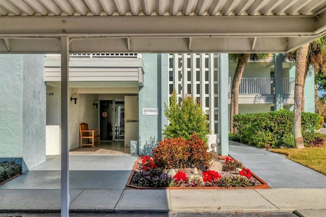 doorway to property with stucco siding