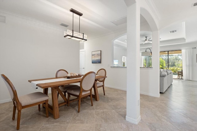 dining space featuring ceiling fan and ornamental molding