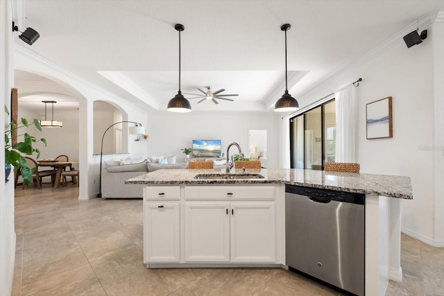 kitchen featuring white cabinets, dishwasher, a raised ceiling, and sink