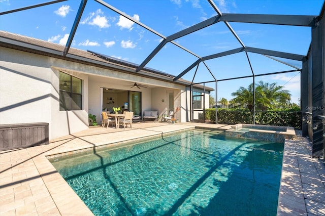 view of pool featuring a lanai, ceiling fan, a patio, and an in ground hot tub