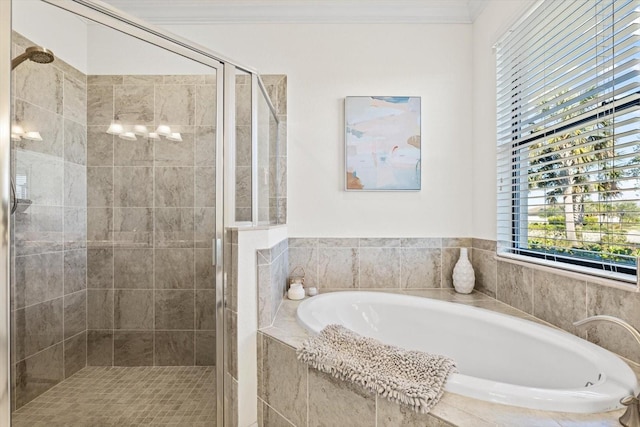 bathroom featuring separate shower and tub and crown molding