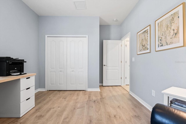 office with light hardwood / wood-style flooring