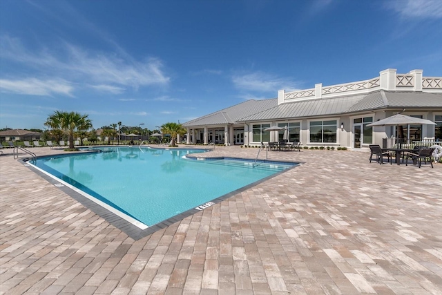 view of swimming pool featuring a patio