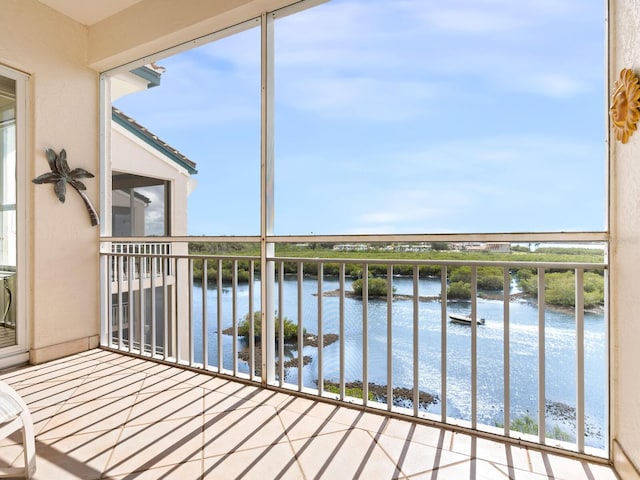 balcony featuring a water view